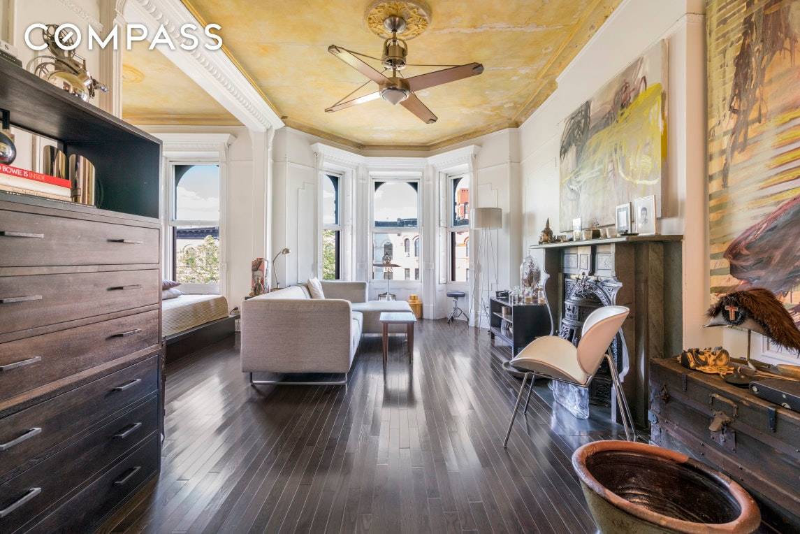 This sunny Park Slope row house full floor condo with low monthlies features most of the original details including shutters, molding, and one remaining castiron wood stove decorative fireplace.