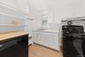 Kitchen with range and dishwasher, new vinyl luxury flooring and freshly painted