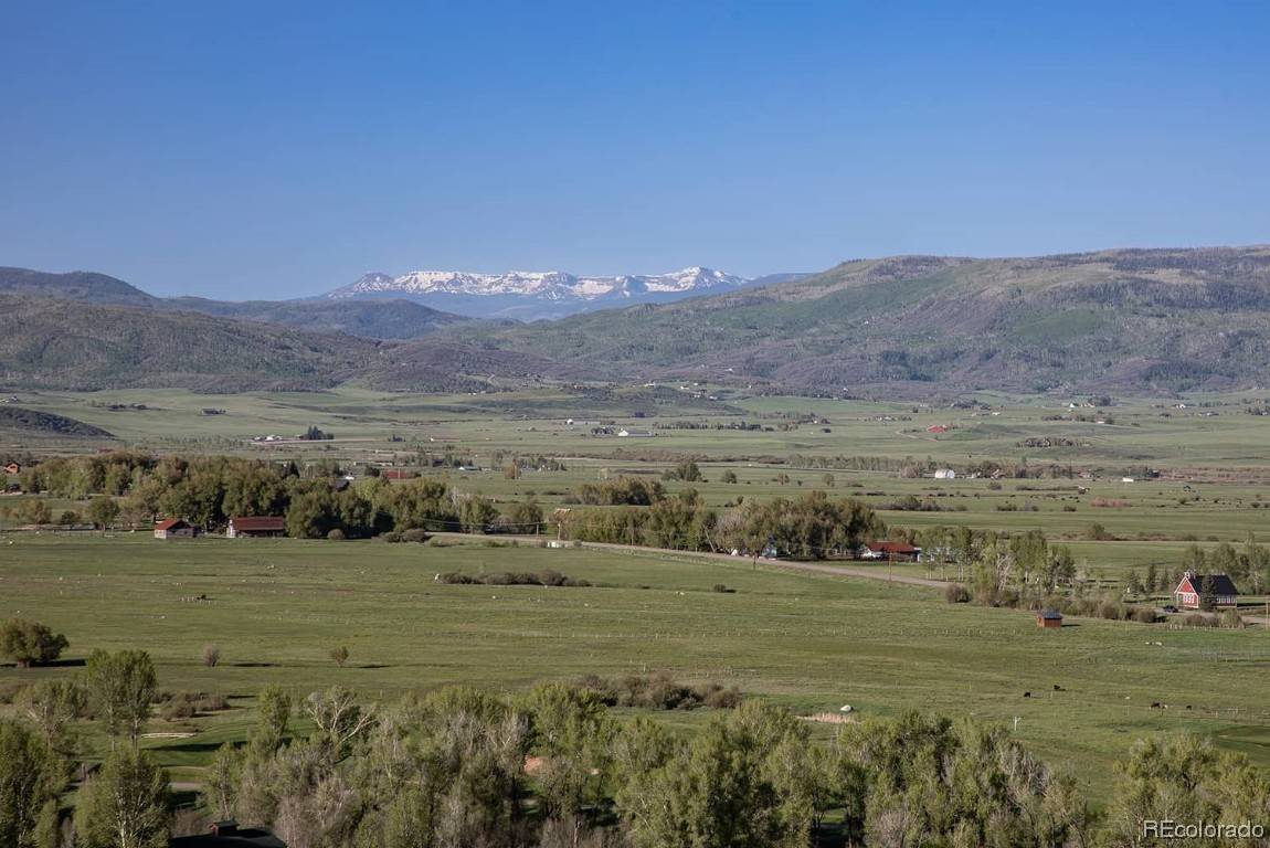Featuring stunning Flat Tops Wilderness Area views, this spectacular Alpine Mountain Ranch Club homesite overlooks the South Valley and is bordered by Catamount Ranch Club golf course fairways to the ...