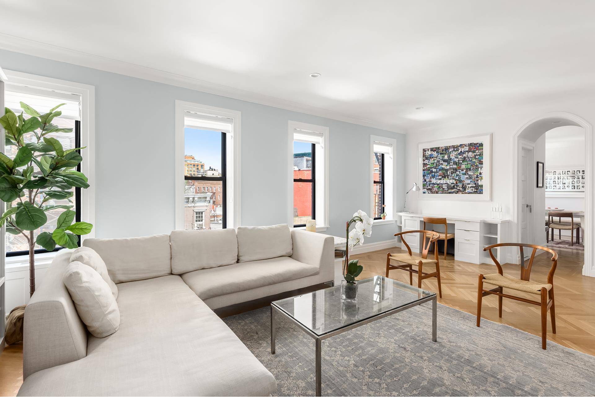 Stunning and sun drenched, this turnkey three bedroom, three bath offering on tree lined West 11th Street is a prime West Village home.