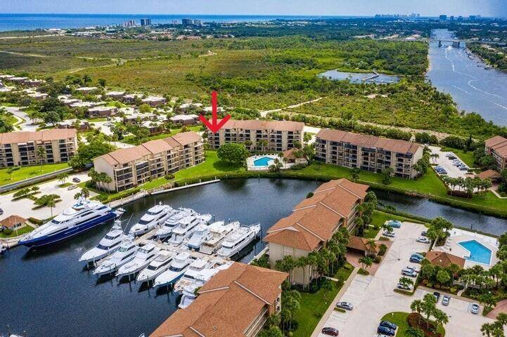 Indulge in coastal luxury with this upgraded two bedroom, two bathroom, end unit condominium, offering stunning marina views from your Large Private Balcony.