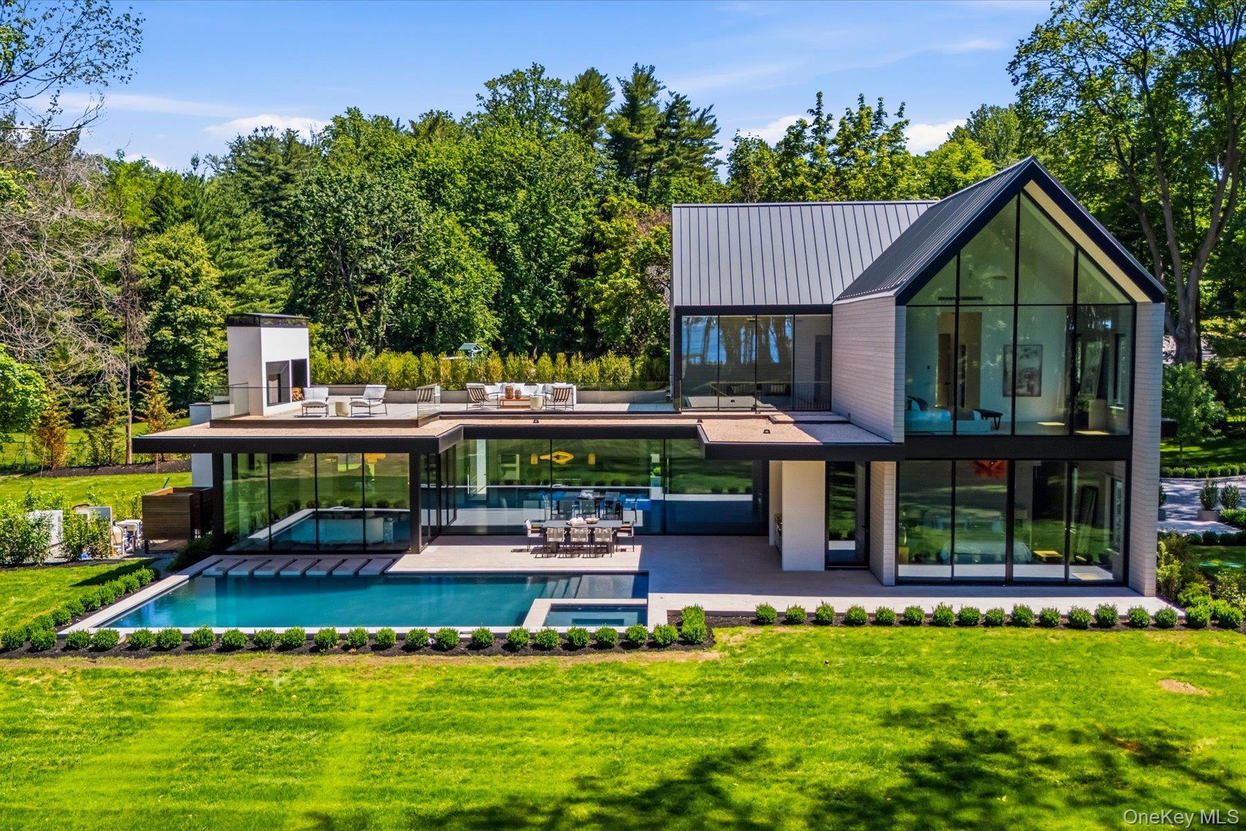 Stunning architecture with floor to ceiling windows, gunite pool and expansive terraces.