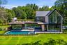 Stunning architecture with floor to ceiling windows, gunite pool and expansive terraces.