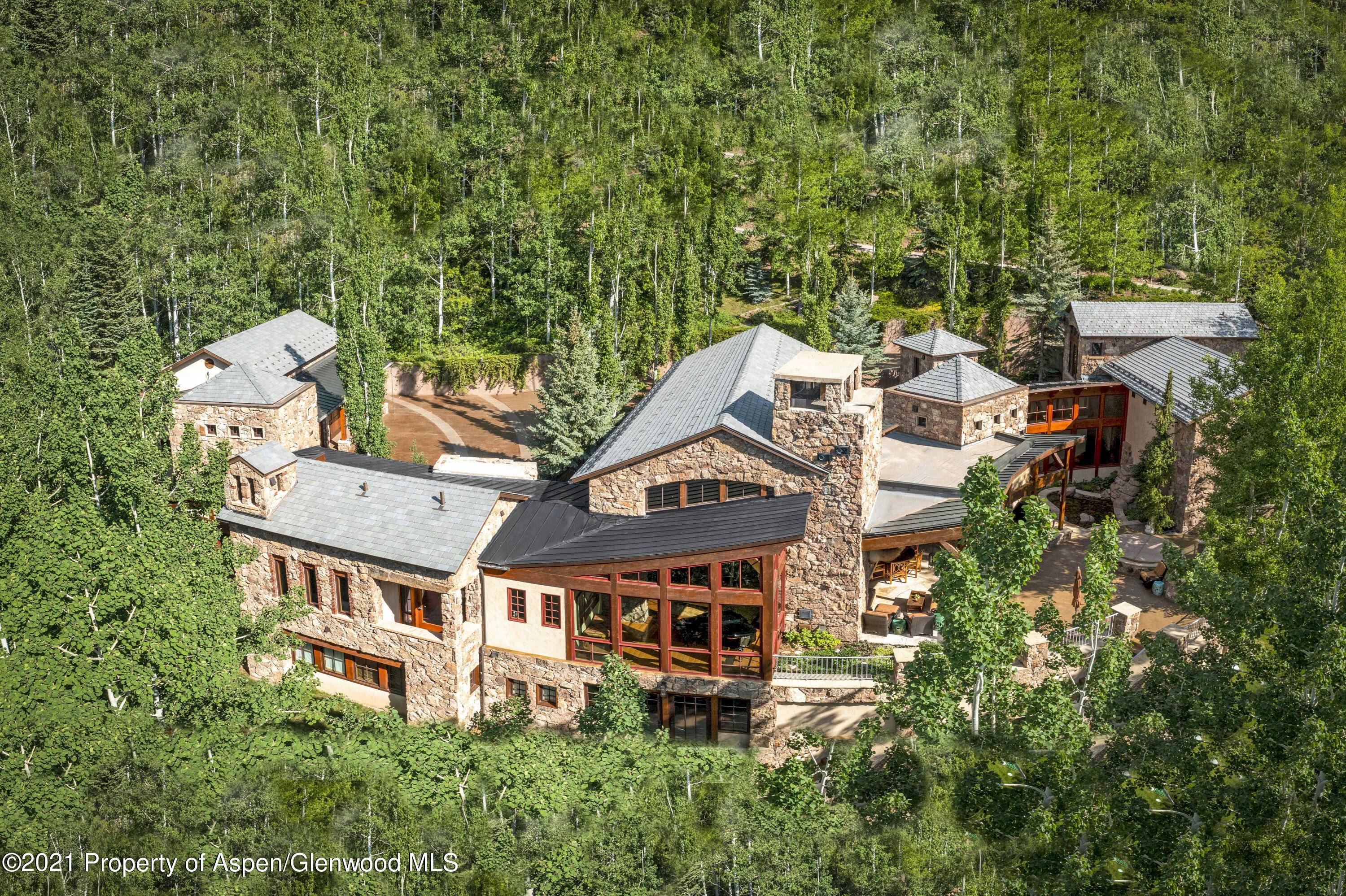 Located at the terminus of secluded Falcon Road in Five Trees, this ski in ski out, 5 bedroom, 9 bath estate embodies architectural artistry, Colorado majesty and ultimate privacy.