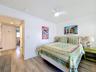 There is lovely artwork throughout the unit. This is the back bedroom