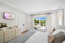 Bedroom with access to exterior, crown molding, a closet, and light wood-type flooring