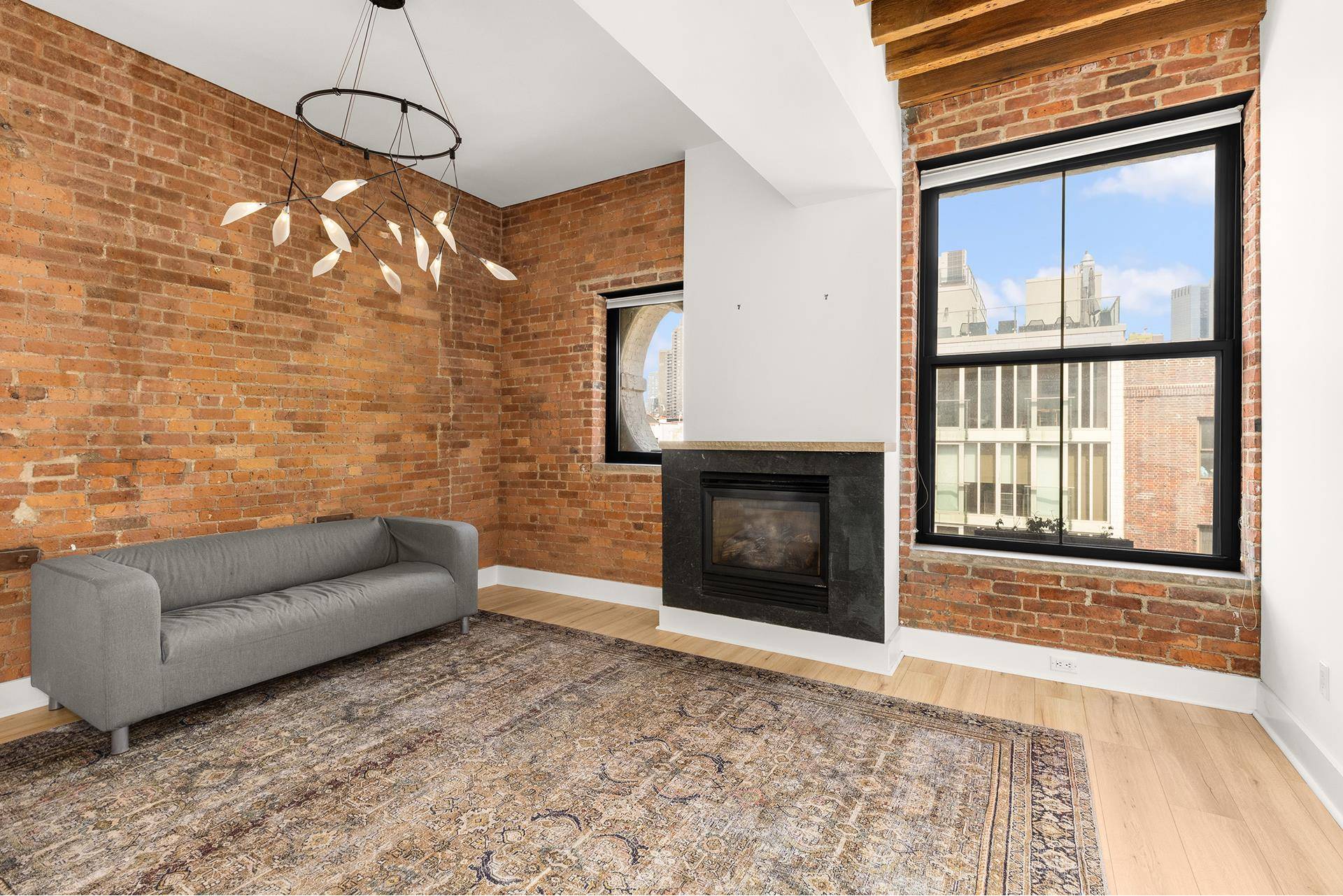 This is a stunner of a unique 1BDR in a renovated 1905 carriage house with beautiful open city views and N W exposures.