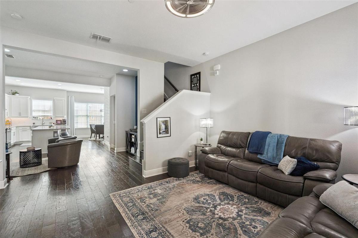 Living room to open concept kitchen and dining