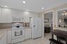 Eat-in Kitchen features a small table as well as a pass through to dining area