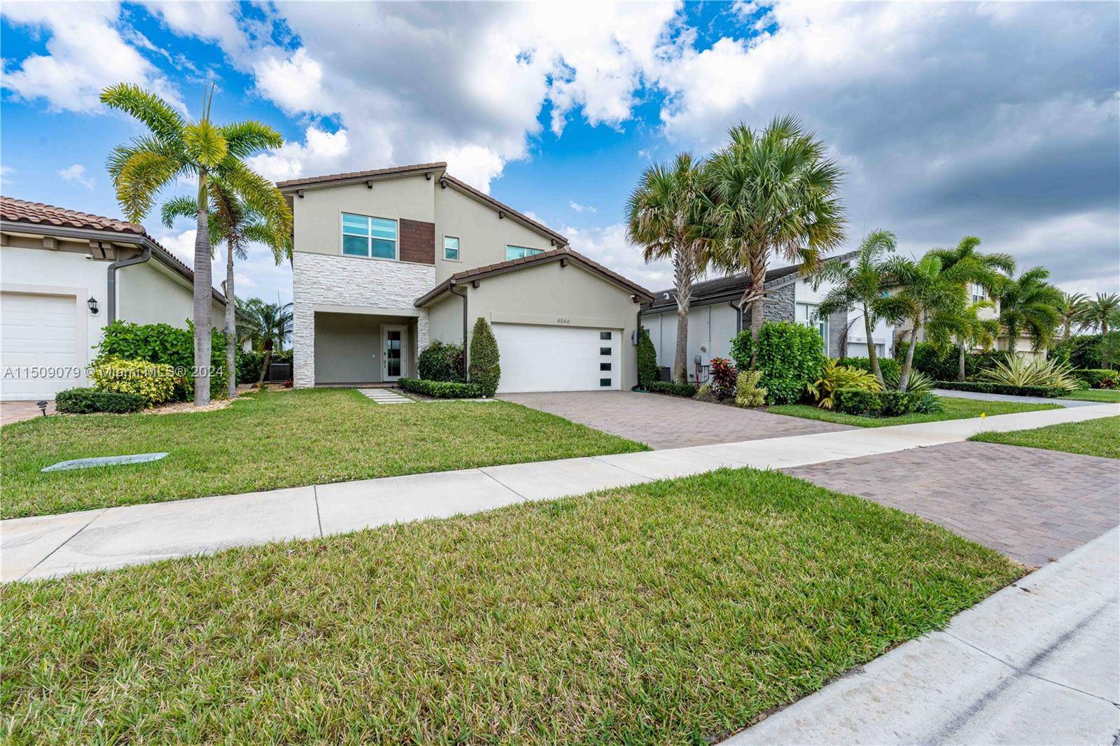 This luxurious waterfront two story heated pool with spa home is fully upgraded, boasting fully impact windows throughout.