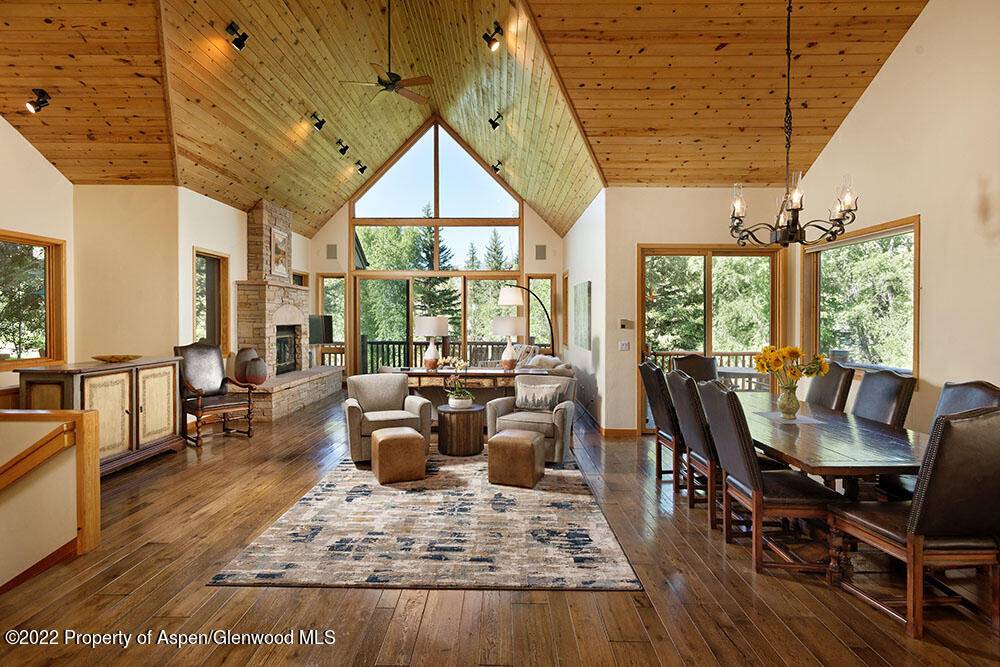 The passive solar designed home offers warmth in the winter and a cool sanctuary in the summer along the Roaring Fork River.