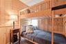 Bedroom with wood walls