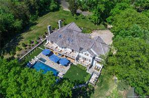 This waterfront oasis built in 2011 is on a sought after cul de sac with breathtaking views of Holly Pond and beyond from almost every room.