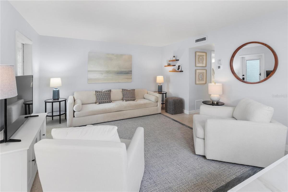 Living Room view from dining area with Large couch (could substitute for sleeper sofa)