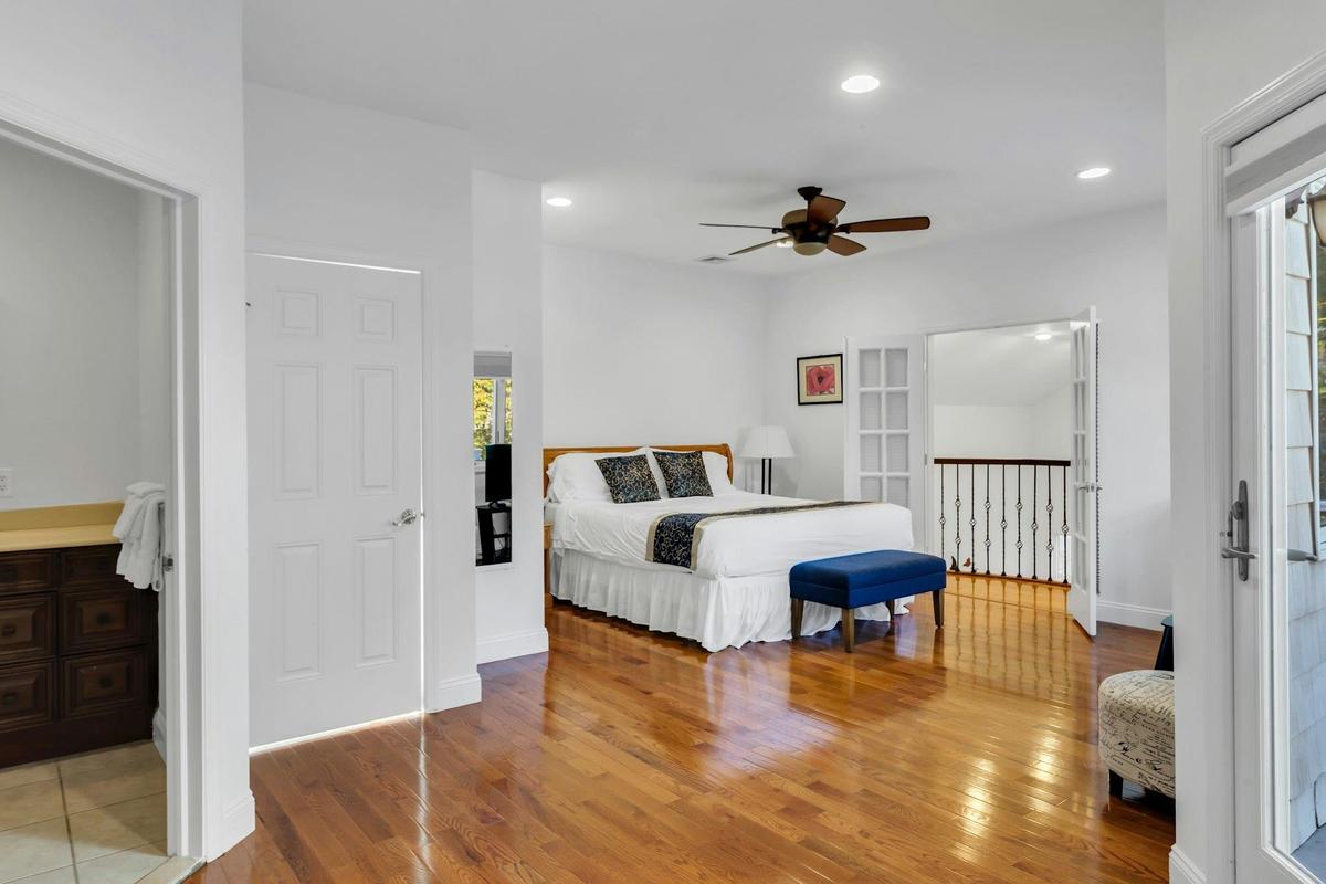 Bedroom with light wood-style floors, recessed lighting, and ceiling fan