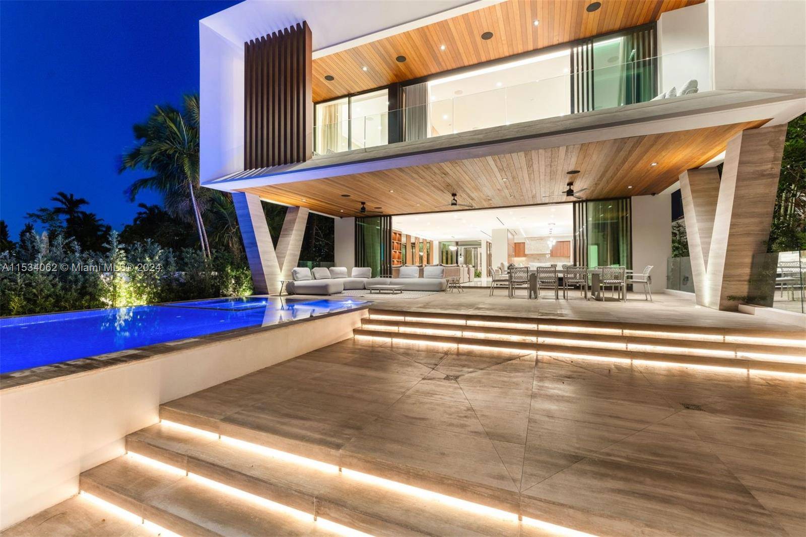 Discover an unrivaled masterpiece of modern tropical design in prestigious Surfside.
