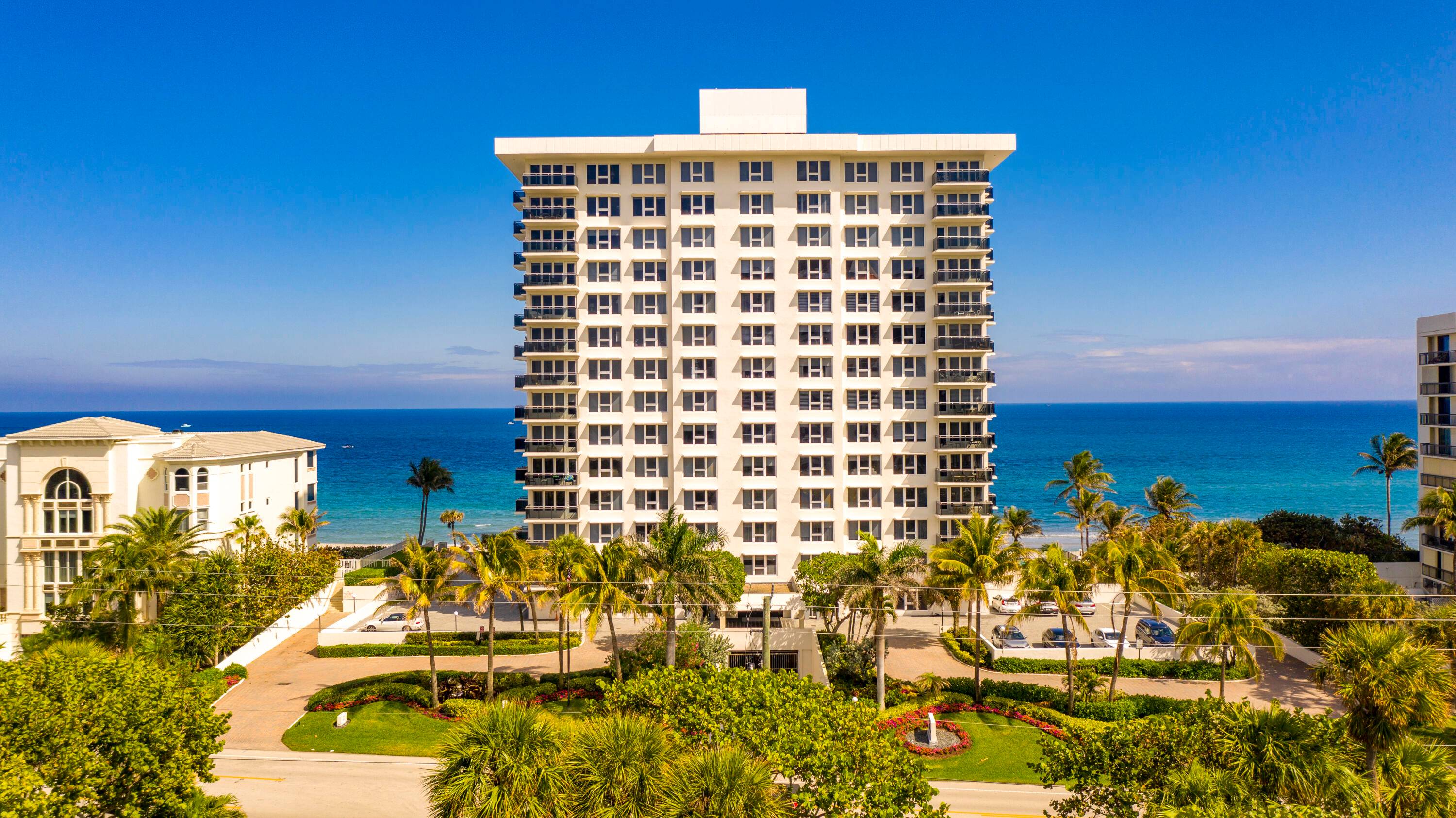 STUNNING OCEAN VIEWS FROM ALL BEDROOMS AND MAIN ROOMS IN THIS COVETED DIRECT OCEANFRONT CORNER CONDOMINIUM IN BOUTIQUE OCEAN REEF TOWERS WITH NEARLY 2000 TOTAL SQUARE FEET !