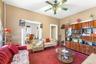 Living room with a ceiling fan and carpet floors