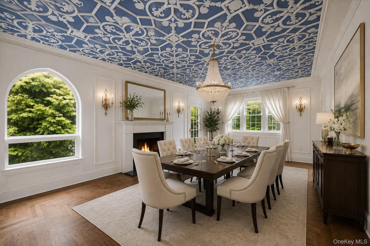 Elegant dining room with an ornamental plasterwork ceiling with another cozy fire place