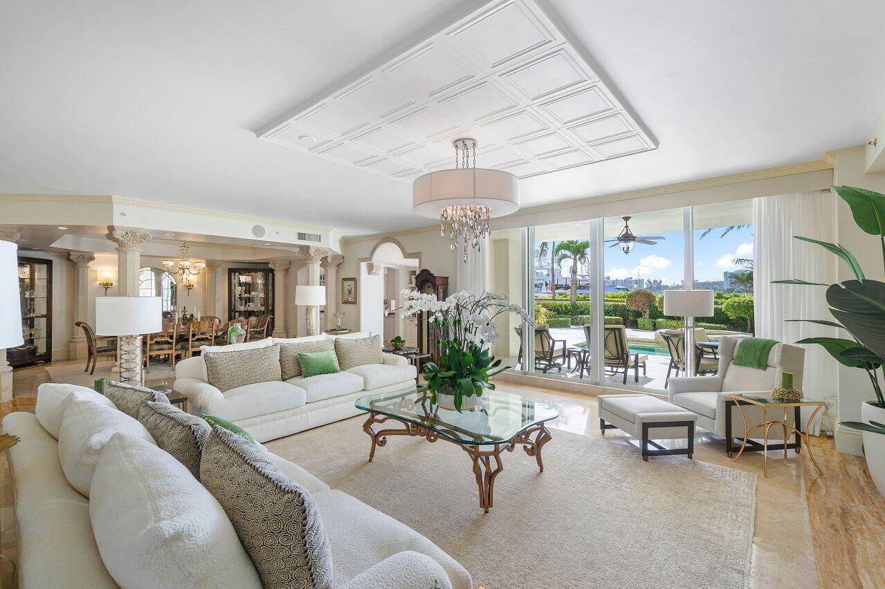 This exceptional residence in Mizner Grand embodies the essence of luxurious living, offering the privacy and elegance reminiscent of a grand estate.