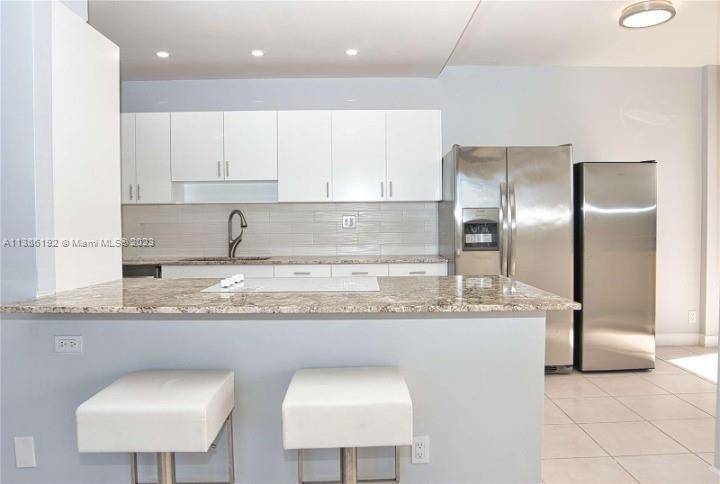 Enter and be wowed by this completely renovated corner unit !