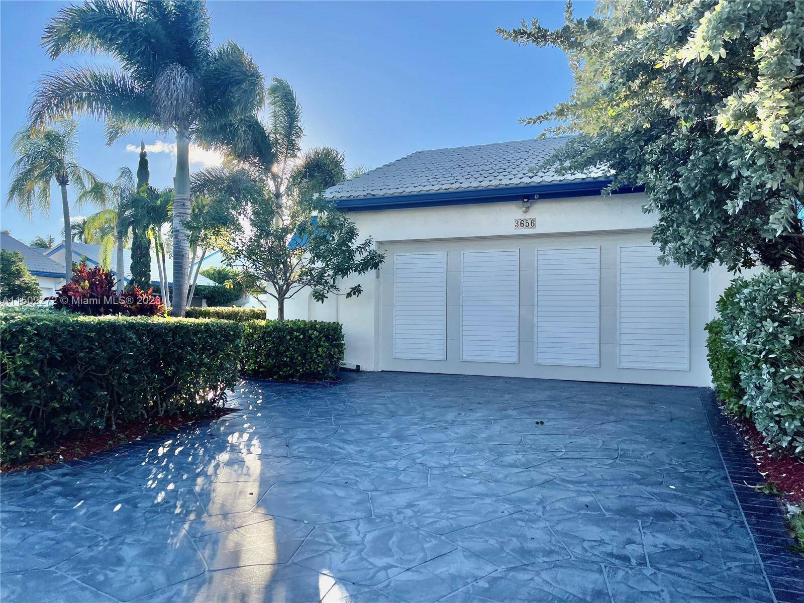GORGEOUS single story modern home in Boca Golf and Tennis Club, fully hurricane proof with a saltwater pool and marble deck WITH PRE DRILLED HOLES IN GROUND FOR EASY POOL ...