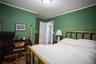 Bedroom featuring ornamental molding and an office area
