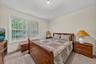 The second bedroom is large with another sunny window.