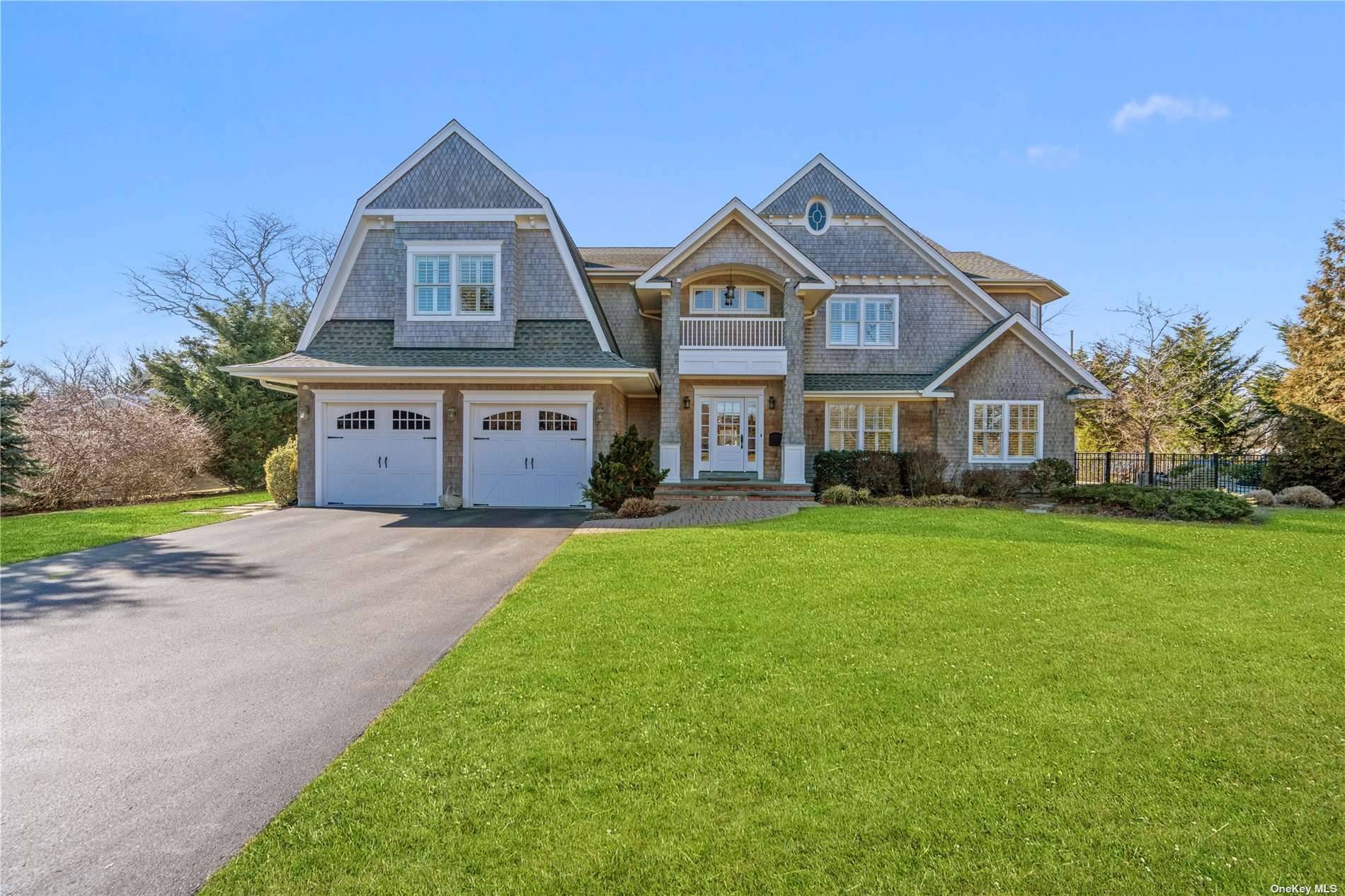 Introducing a captivating new waterfront home in West Islip.