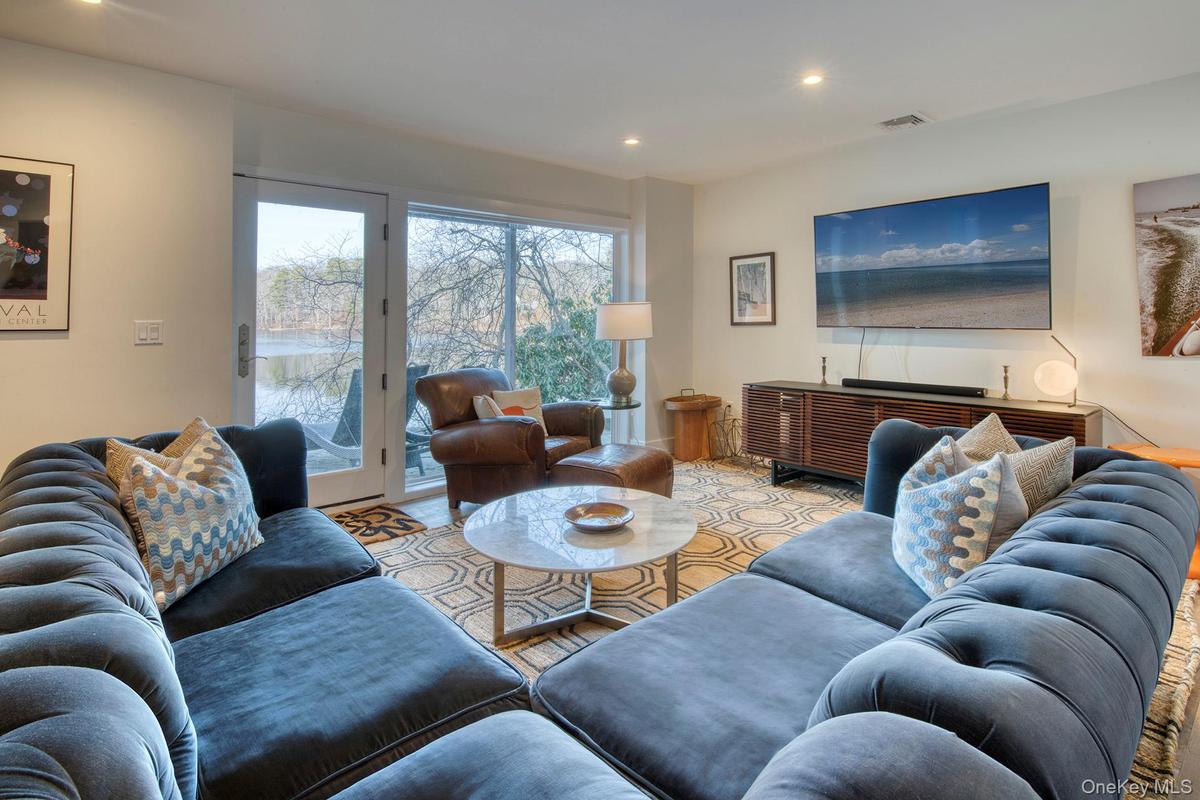 Living room with visible vents and recessed lighting