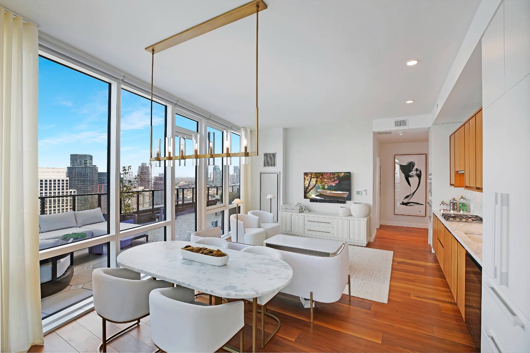 Upon entering this FULLY FURNISHED two bed, two bath unit, make your way through the foyer where you will be greeted by the Manhattan skyline from every room !
