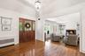 Gleaming hardwood floors are found throughout.