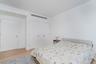 Bedroom with light wood-type flooring and baseboards