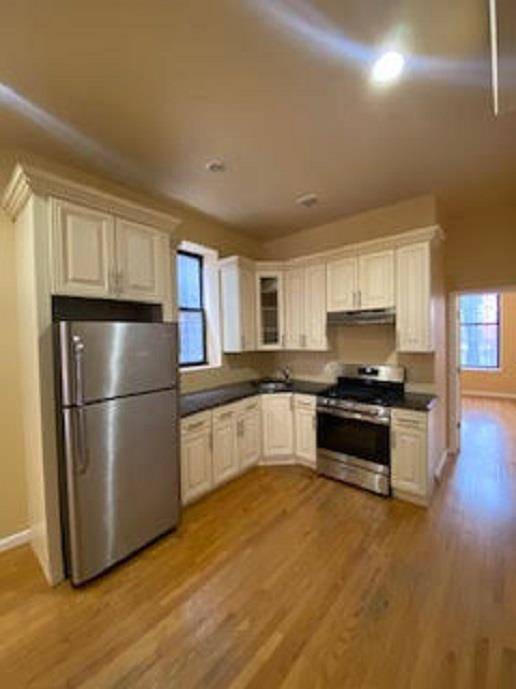 True 3 bedroom apartment all new renovations, wood floors, stainless still appliances 1 flight walk up only.