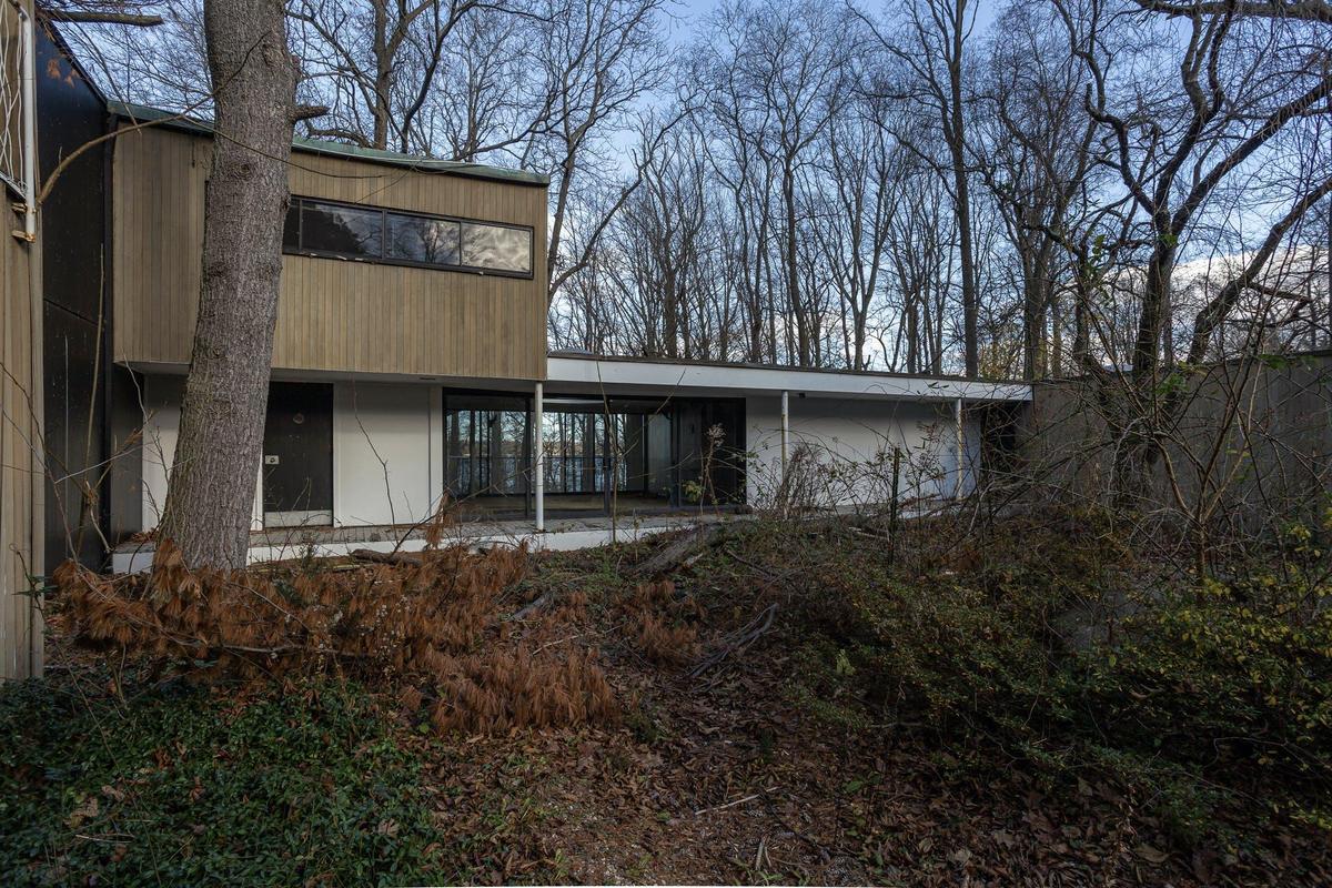 Rear view of property featuring a carport