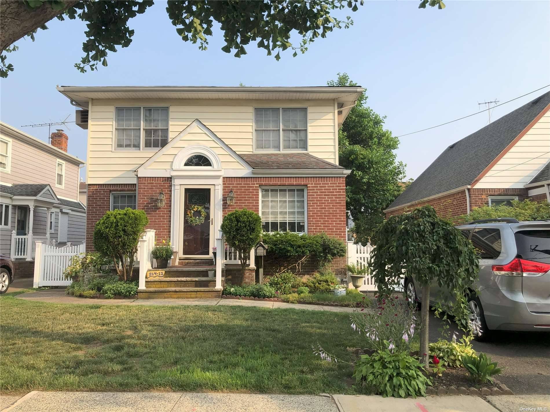 Well Maintained Dormered Cape Style Home Located In Glen Oaks, Queens.