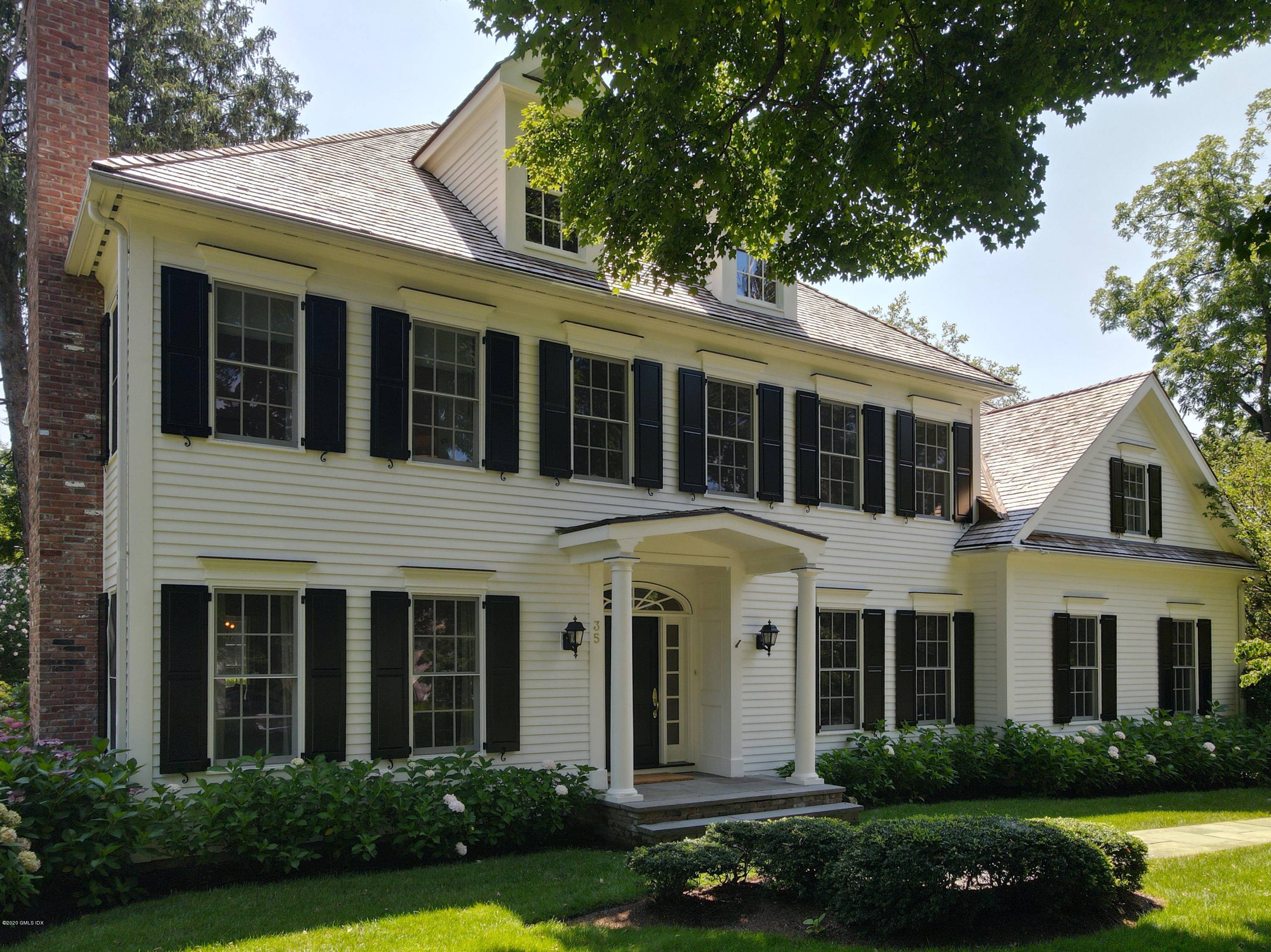 Pristine and fresh 5 BR classic colonial south of the Village in OG.