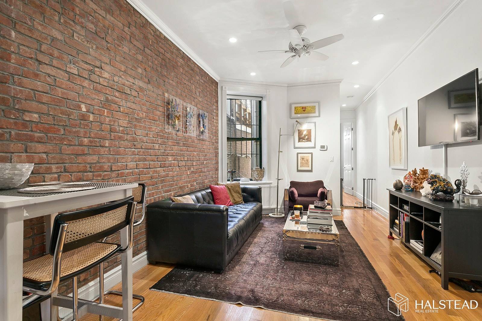 This mint parlor Brownstone 2 bed 2 bath home has been beautifully restored with crown moldings, walnut wood floors, exposed brick, open kitchen with granite counter tops, white cabinets and ...