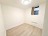 Second Bedroom with light wood-type flooring and radiator