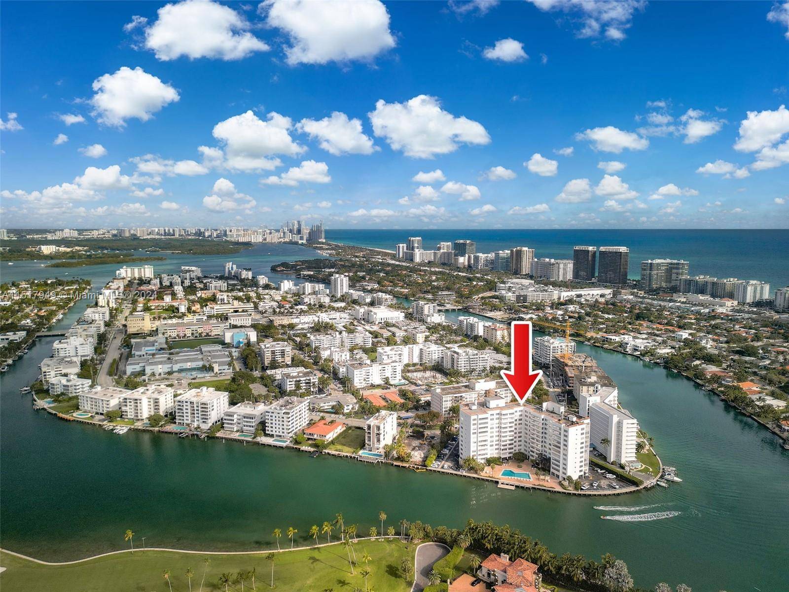 Enjoy panoramic views of Biscayne Bay and Indian Creek golf course from this 1150 SF condo at Blair House, Bay Harbor Islands.