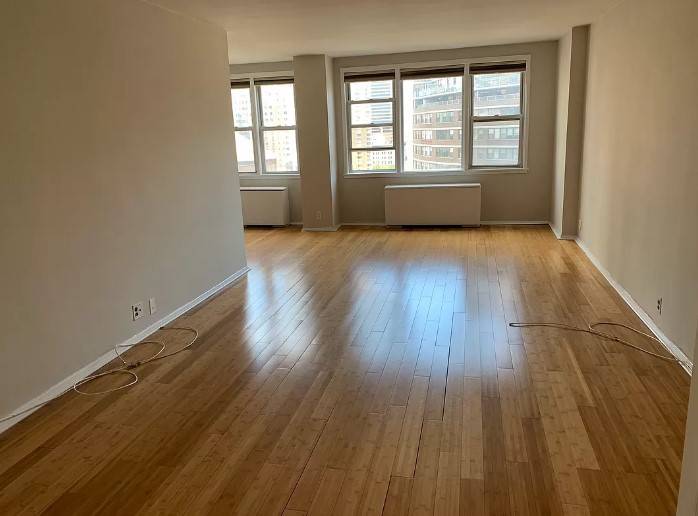 Large sun drenched 800 square foot fully renovated 1 bedroom apartment with a windowed office alcove is on the 14th floor of a 24 hour doorman building.