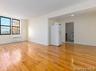 Unfurnished room featuring light wood-type flooring and radiator