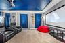 custom designed movie theater with 6 reclining chairs and 120" projector, and sound system.
