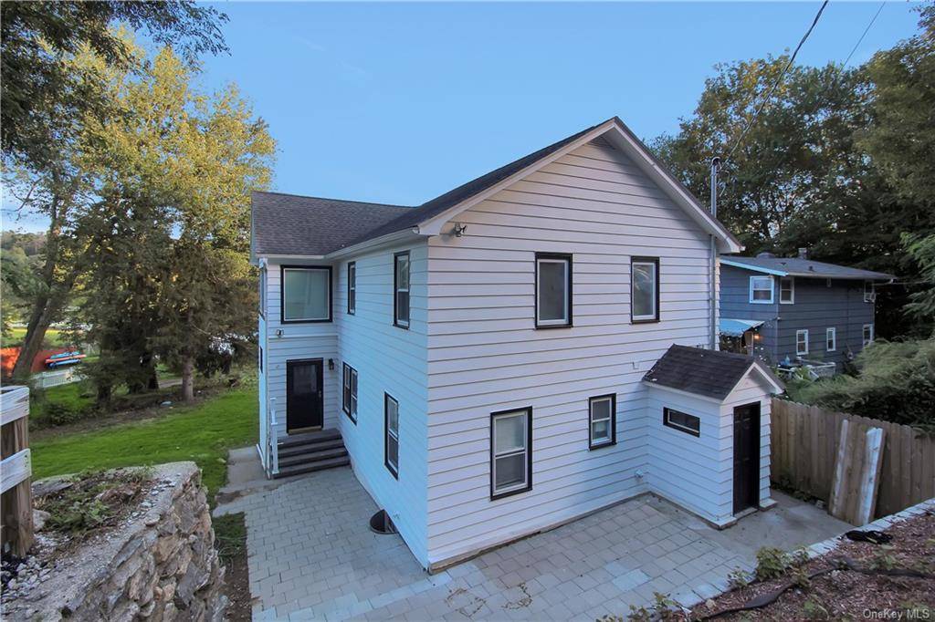 Welcome home to this beautifully renovated single family home with a spectacular view of Oceola Lake.