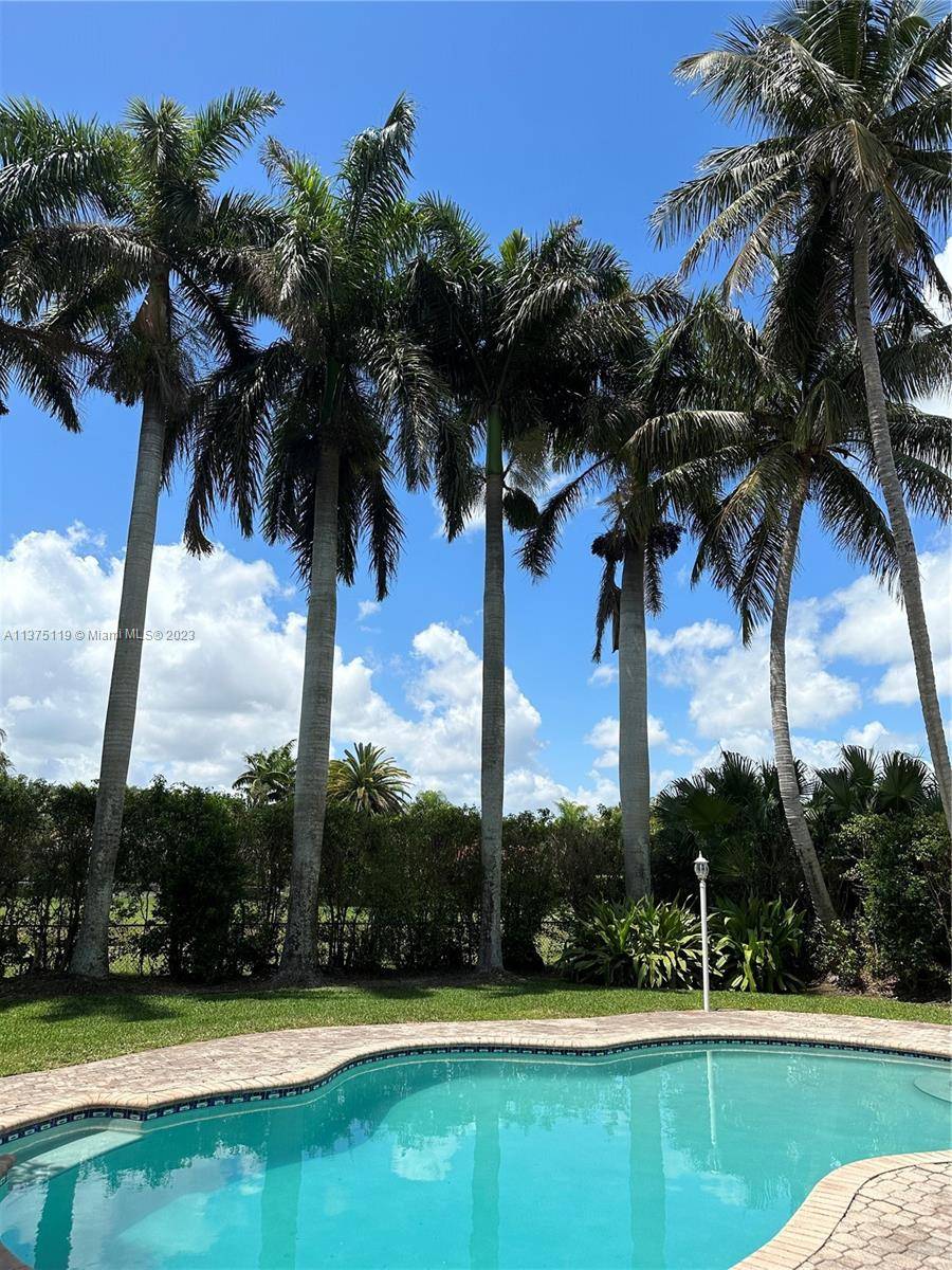 Beautiful and spacious Palmetto Bay pool home tucked away on a private street.