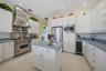Kitchen with Gas Viking Stove and Vent Hood