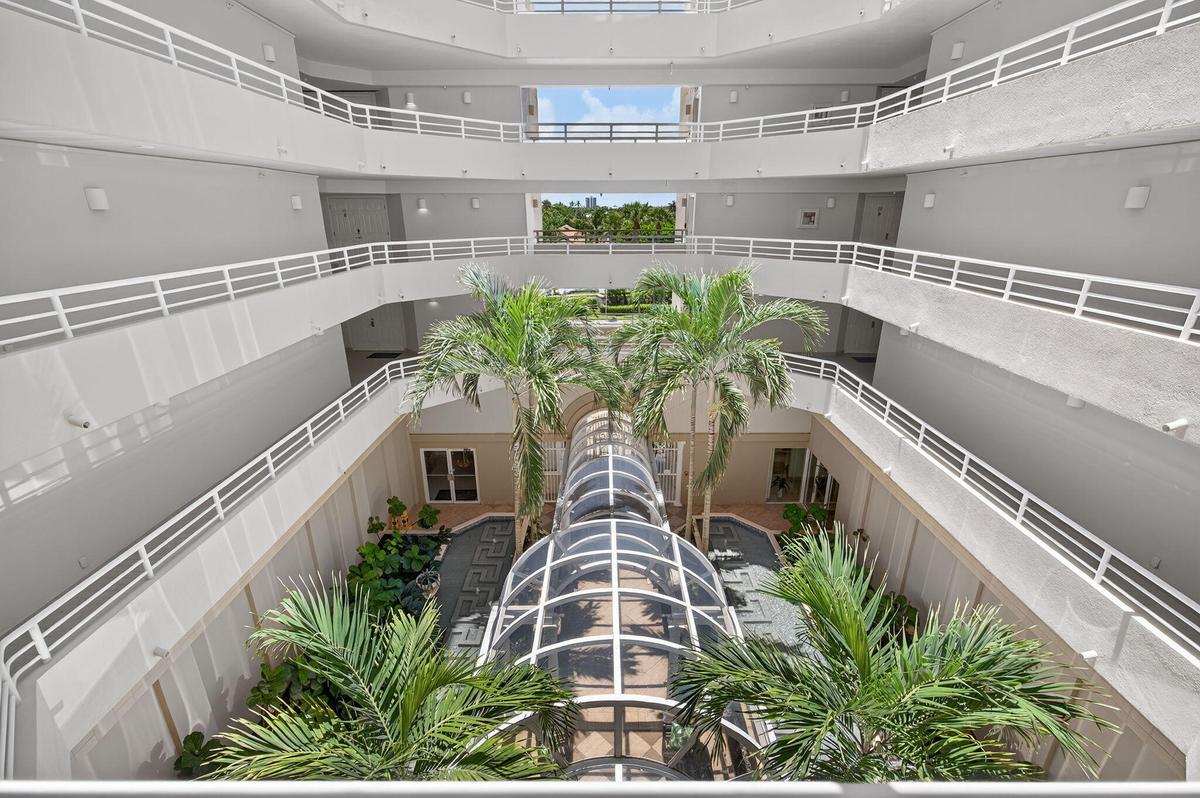 Stunning open-air atrium, bringing natural light and tropical beauty to the heart of the building.