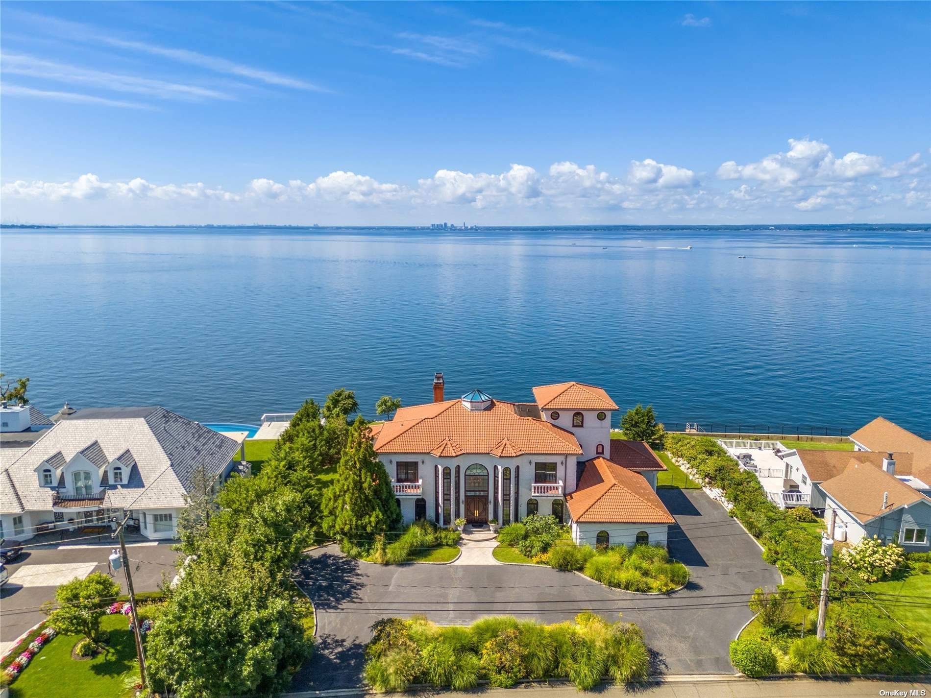 Embrace the allure of island living in this elegant custom built waterfront gem.