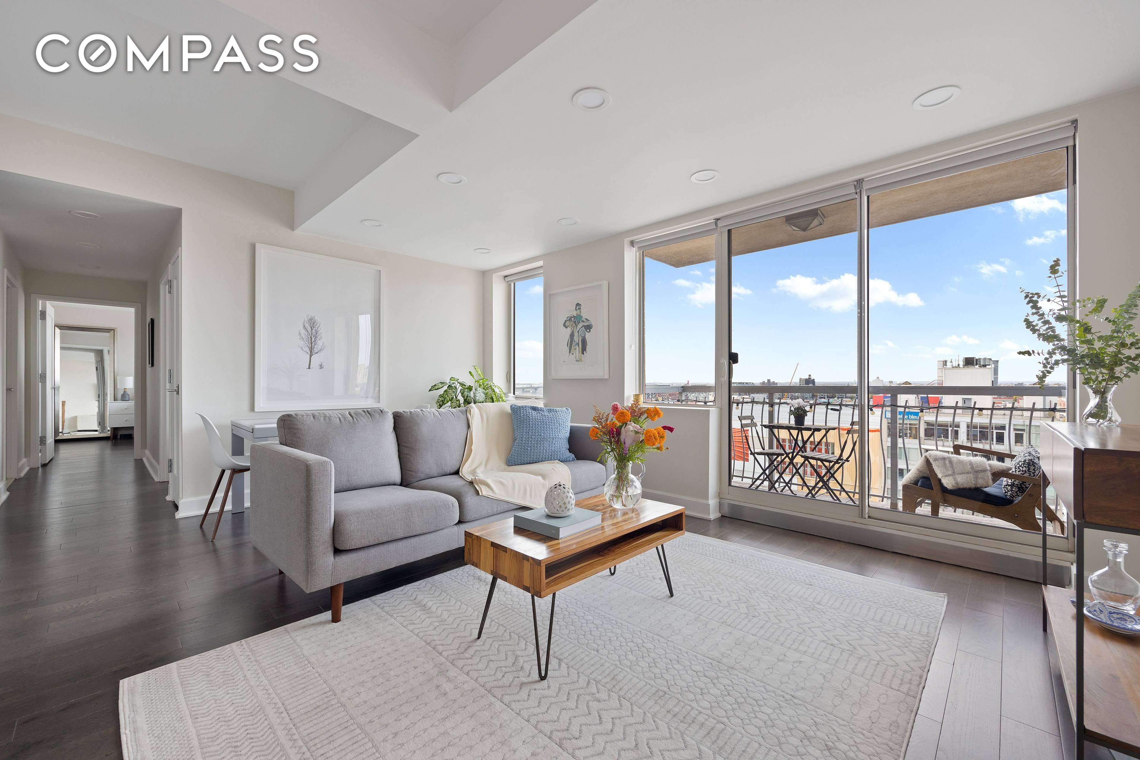 This modern, bright and airy apartment has an open living space with a private balcony offering spectacular views of the city s skyline and stunning sunsets.