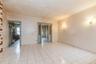 Empty room featuring ornamental molding and light tile patterned flooring